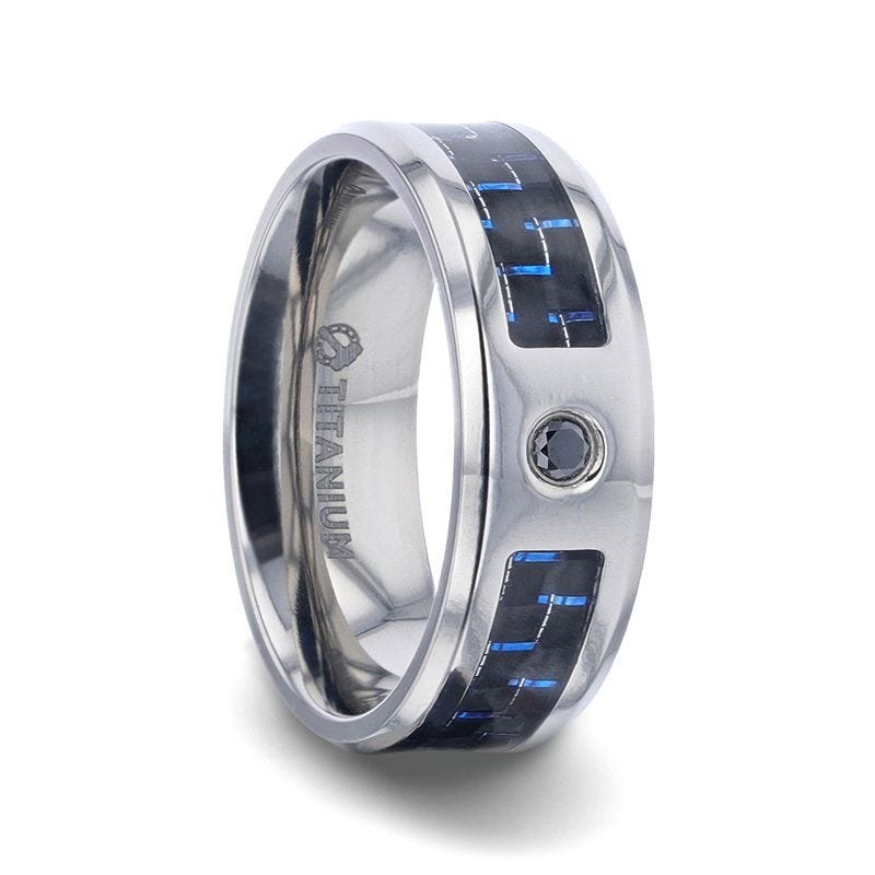 Thorsten PACIFIC Black And Blue Carbon Fiber Inlaid Titanium Men's Wedding Band With Beveled Polished Edges and Black Sapphire Center Stone Thorsten PACIFIC Black And Blue Carbon Fiber Inlaid Titanium Men's Wedding Band With Beveled Polished Edges and Black Sapphire Center Stone